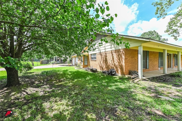 9820 Hillsboro Dr, Shreveport, LA 71118 - view of property exterior with brick siding and a yard