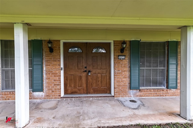 9820 Hillsboro Dr, Shreveport, LA 71118 - property entrance featuring brick siding and a porch