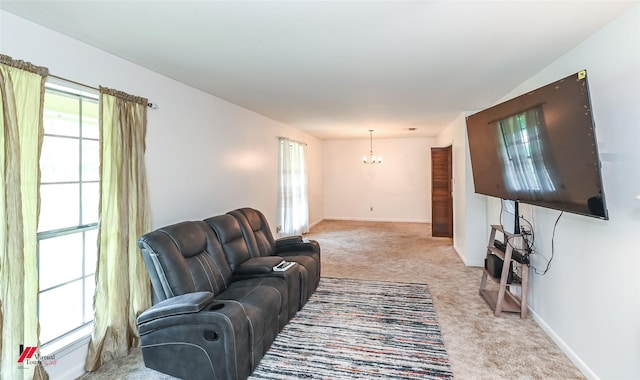 9820 Hillsboro Dr, Shreveport, LA 71118 - living area featuring an inviting chandelier, baseboards, plenty of natural light, and light colored carpet
