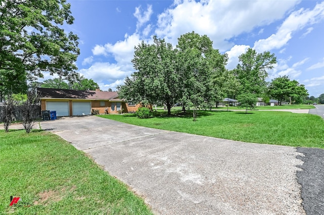 9820 Hillsboro Dr, Shreveport, LA 71118 - view of front of property with driveway, a front yard, and a garage