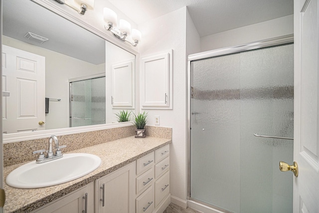 6127 Welden Ct, Fort Worth, TX 76132 - full bathroom featuring visible vents, vanity, and a stall shower
