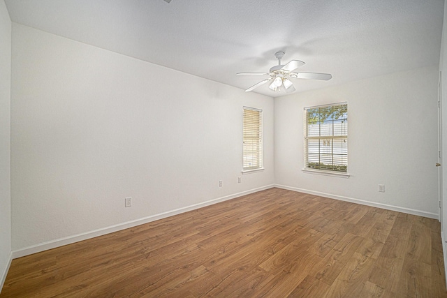 6127 Welden Ct, Fort Worth, TX 76132 - spare room with baseboards, a ceiling fan, and wood finished floors