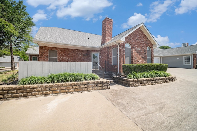 6127 Welden Ct, Fort Worth, TX 76132 - ranch-style home featuring a chimney, concrete driveway, fence, a garage, and brick siding