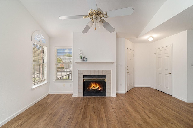 6127 Welden Ct, Fort Worth, TX 76132 - unfurnished living room featuring baseboards, a ceiling fan, wood finished floors, and a tiled fireplace