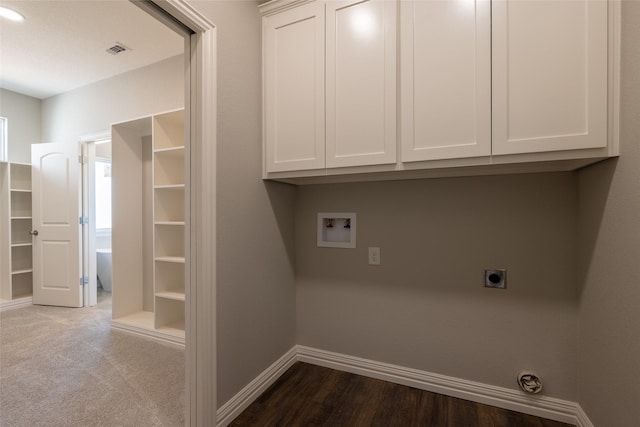 2567 Fm 368, Iowa Park, TX 76367 - laundry area featuring visible vents, baseboards, hookup for a washing machine, cabinet space, and electric dryer hookup