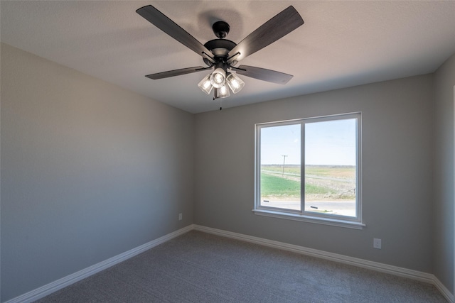 2567 Fm 368, Iowa Park, TX 76367 - empty room with baseboards, a ceiling fan, and carpet flooring