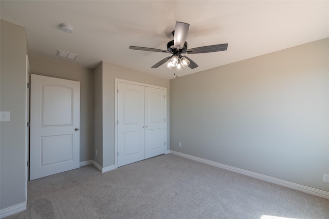 2567 Fm 368, Iowa Park, TX 76367 - unfurnished bedroom featuring a closet, a ceiling fan, baseboards, and light carpet