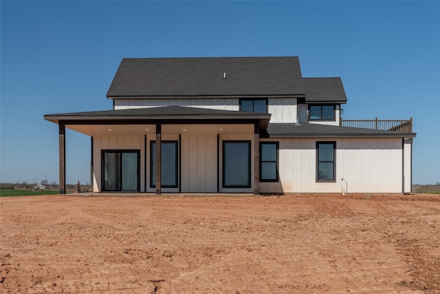 2567 Fm 368, Iowa Park, TX 76367 - rear view of house with board and batten siding and roof with shingles