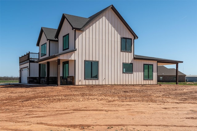 2567 Fm 368, Iowa Park, TX 76367 - view of side of property with board and batten siding and a shingled roof