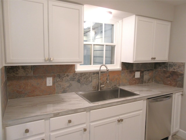 415 Easy St, Marlin, TX 76661 - kitchen with dishwasher, white cabinetry, tasteful backsplash, and a sink