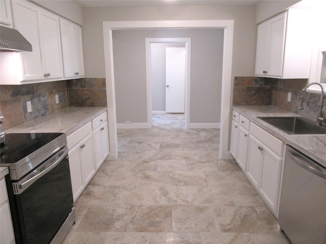 415 Easy St, Marlin, TX 76661 - kitchen featuring a sink, decorative backsplash, appliances with stainless steel finishes, white cabinets, and under cabinet range hood