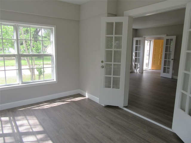415 Easy St, Marlin, TX 76661 - spare room with dark wood finished floors, baseboards, and french doors