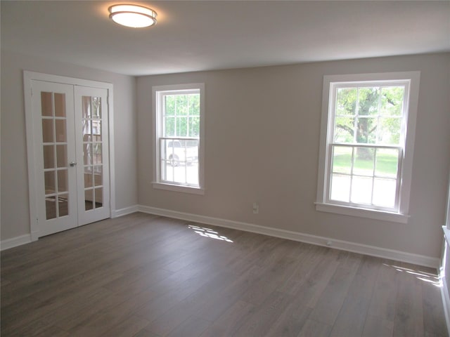 415 Easy St, Marlin, TX 76661 - spare room featuring wood finished floors, baseboards, and french doors