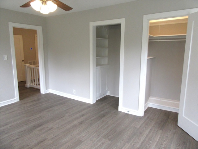 415 Easy St, Marlin, TX 76661 - unfurnished bedroom with wood finished floors, a closet, and baseboards