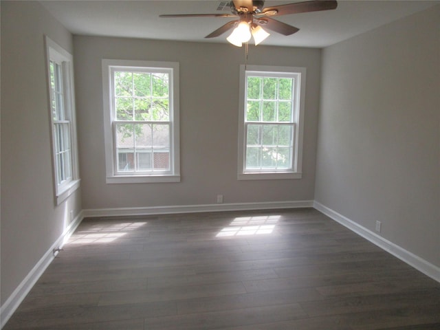 415 Easy St, Marlin, TX 76661 - unfurnished room featuring baseboards, ceiling fan, and dark wood finished floors