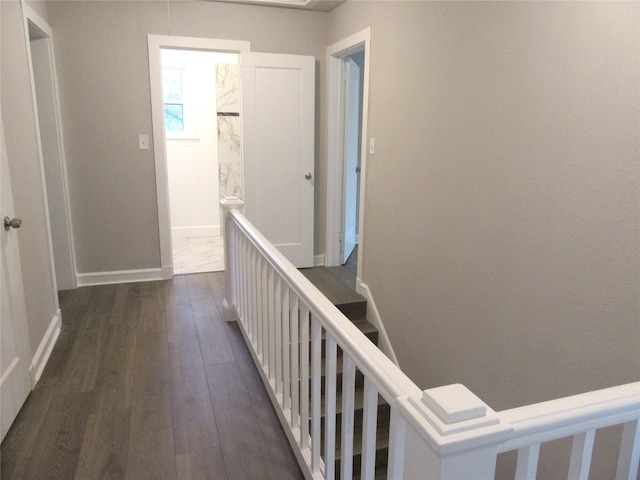 415 Easy St, Marlin, TX 76661 - hall featuring baseboards and dark wood-type flooring