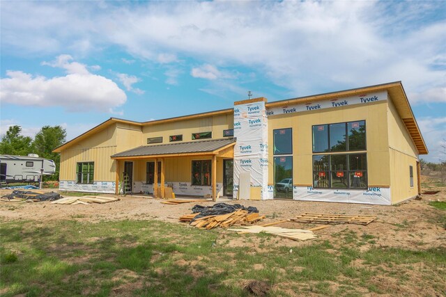 exterior space with metal roof