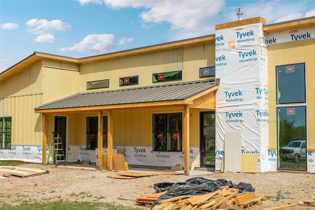 exterior space with metal roof