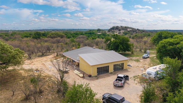 drone / aerial view with a forest view