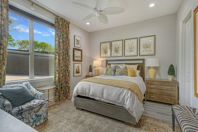 bedroom featuring ceiling fan, wood finished floors, and recessed lighting