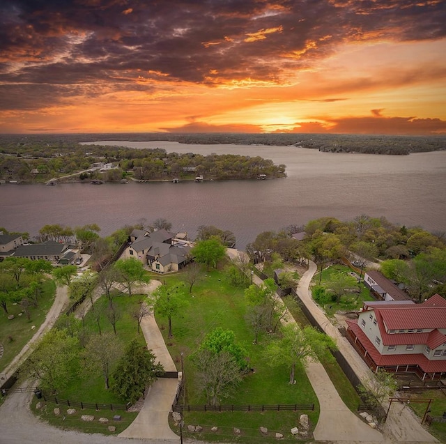 aerial view at dusk with a water view