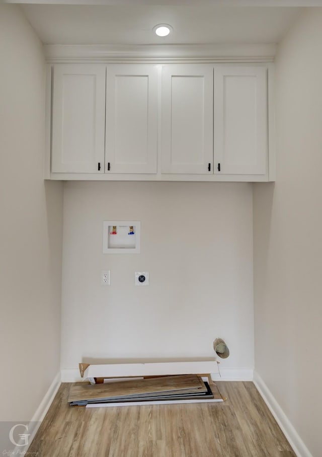 laundry room with electric dryer hookup, baseboards, wood finished floors, and hookup for a washing machine