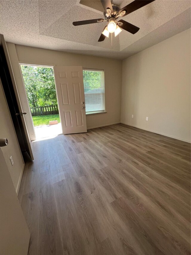 interior space featuring wood finished floors and a ceiling fan