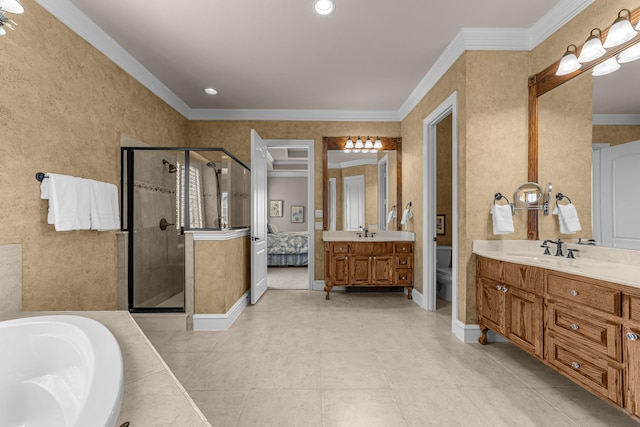 ensuite bathroom with toilet, a stall shower, baseboards, crown molding, and vanity