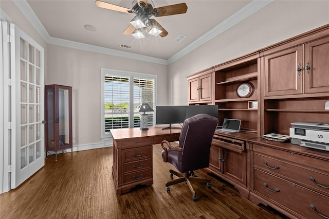 home office with a ceiling fan, dark wood-style flooring, crown molding, and visible vents