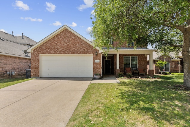 single story home featuring a garage, brick siding, a front yard, and concrete driveway