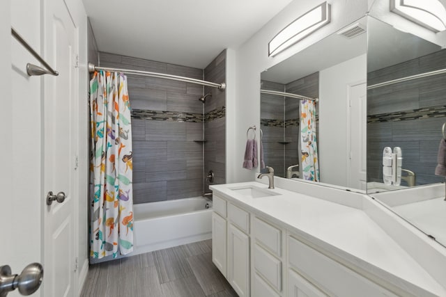 bathroom with vanity and shower / bath combo