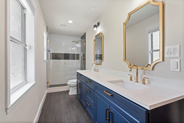 2744 Bay Meadows Ct, Farmers Branch, TX 75234 - bathroom featuring double vanity, toilet, a shower stall, wood finished floors, and recessed lighting