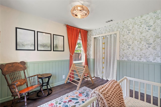 2744 Bay Meadows Ct, Farmers Branch, TX 75234 - bedroom featuring wainscoting, wood finished floors, and wallpapered walls