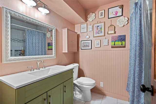 2744 Bay Meadows Ct, Farmers Branch, TX 75234 - bathroom with toilet, vanity, tile patterned floors, a wainscoted wall, and a shower with shower curtain