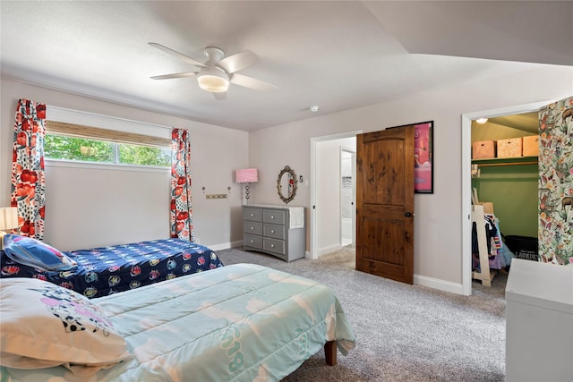 2744 Bay Meadows Ct, Farmers Branch, TX 75234 - carpeted bedroom featuring a walk in closet, a closet, a ceiling fan, and baseboards