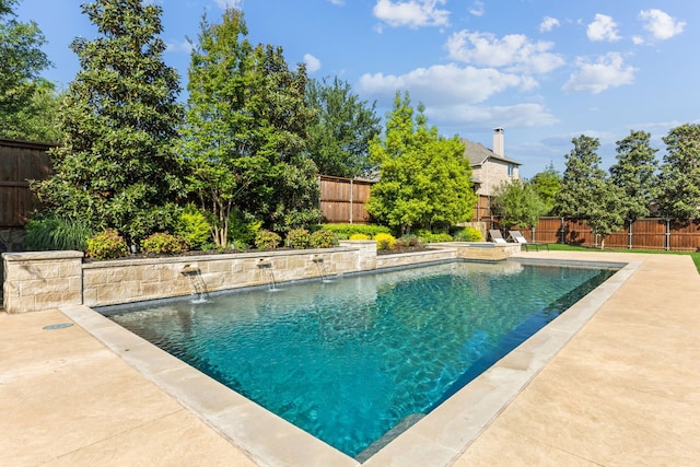 view of swimming pool featuring a fenced in pool and a fenced backyard