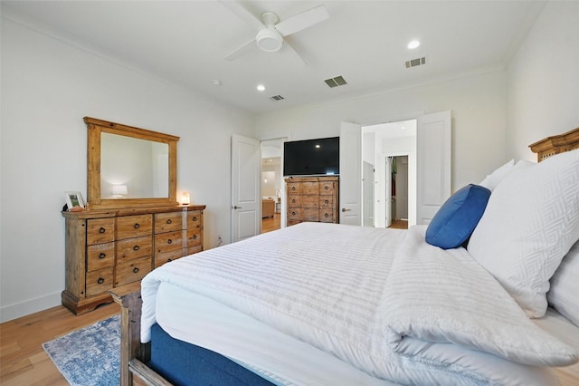 bedroom with baseboards, recessed lighting, light wood-style flooring, and visible vents