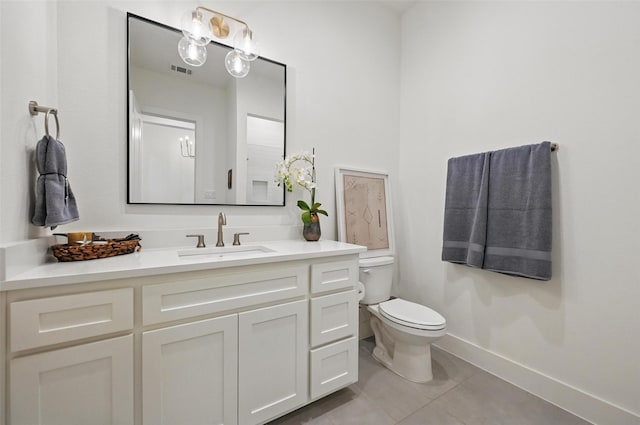 bathroom with visible vents, tile patterned flooring, vanity, toilet, and baseboards