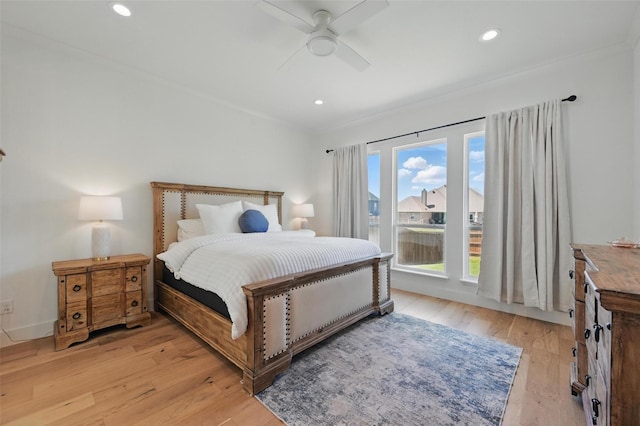 bedroom featuring light wood-style floors, a ceiling fan, and recessed lighting