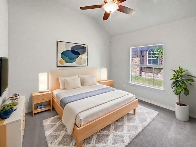 bedroom with concrete floors, lofted ceiling, a ceiling fan, and baseboards