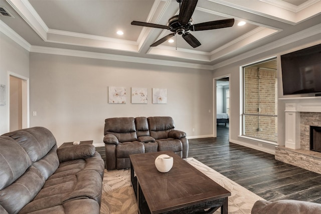5124 Cathedral Ln, Wichita Falls, TX 76310 - living room featuring dark wood finished floors, a stone fireplace, a ceiling fan, crown molding, and baseboards
