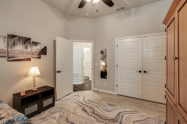 5124 Cathedral Ln, Wichita Falls, TX 76310 - bedroom with ceiling fan, a closet, visible vents, and light wood-style flooring