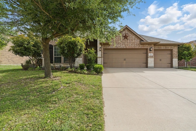 obstructed view of property with concrete driveway, brick siding, a front yard, and a garage