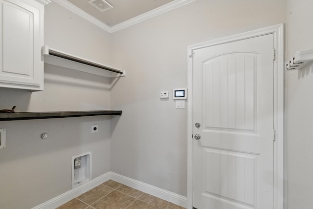 laundry area with hookup for an electric dryer, baseboards, visible vents, cabinet space, and ornamental molding