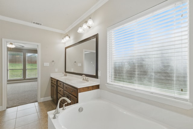 bathroom featuring tile patterned floors, double vanity, visible vents, a sink, and crown molding