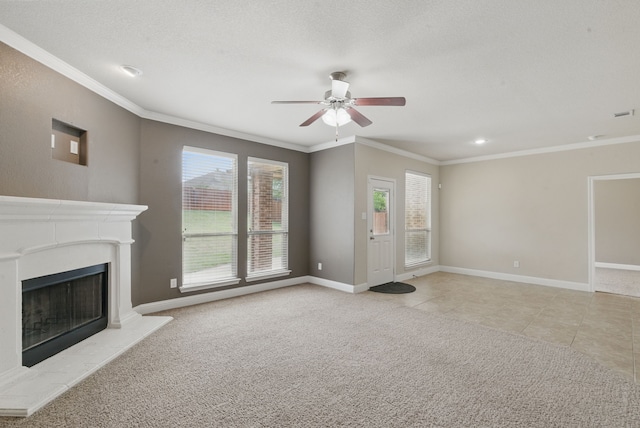 unfurnished living room featuring a ceiling fan, baseboards, a fireplace with raised hearth, and ornamental molding