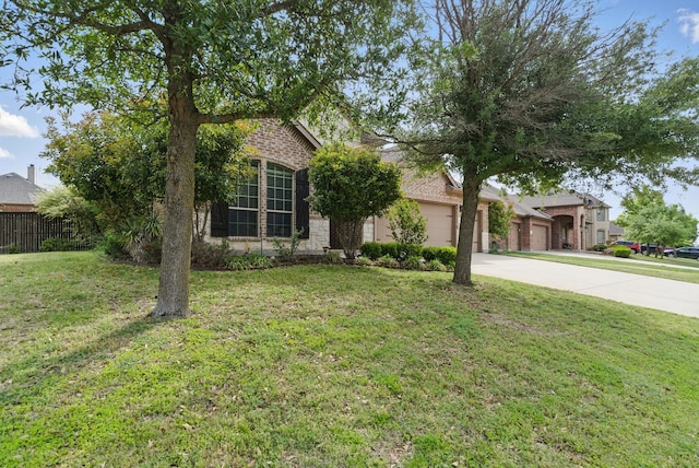 obstructed view of property with a front lawn, driveway, fence, and a garage