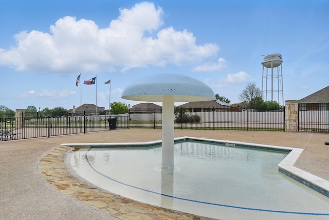 view of swimming pool featuring a fenced in pool and fence