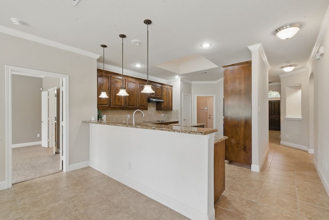 kitchen featuring light tile patterned floors, ornamental molding, light stone counters, and tasteful backsplash