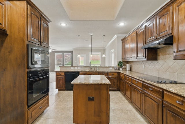 kitchen with under cabinet range hood, ornamental molding, a sink, black appliances, and a peninsula